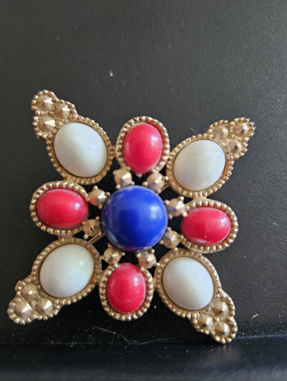 Gold-Tone Starburst Brooch with Blue, Pink and Cream Cabochons